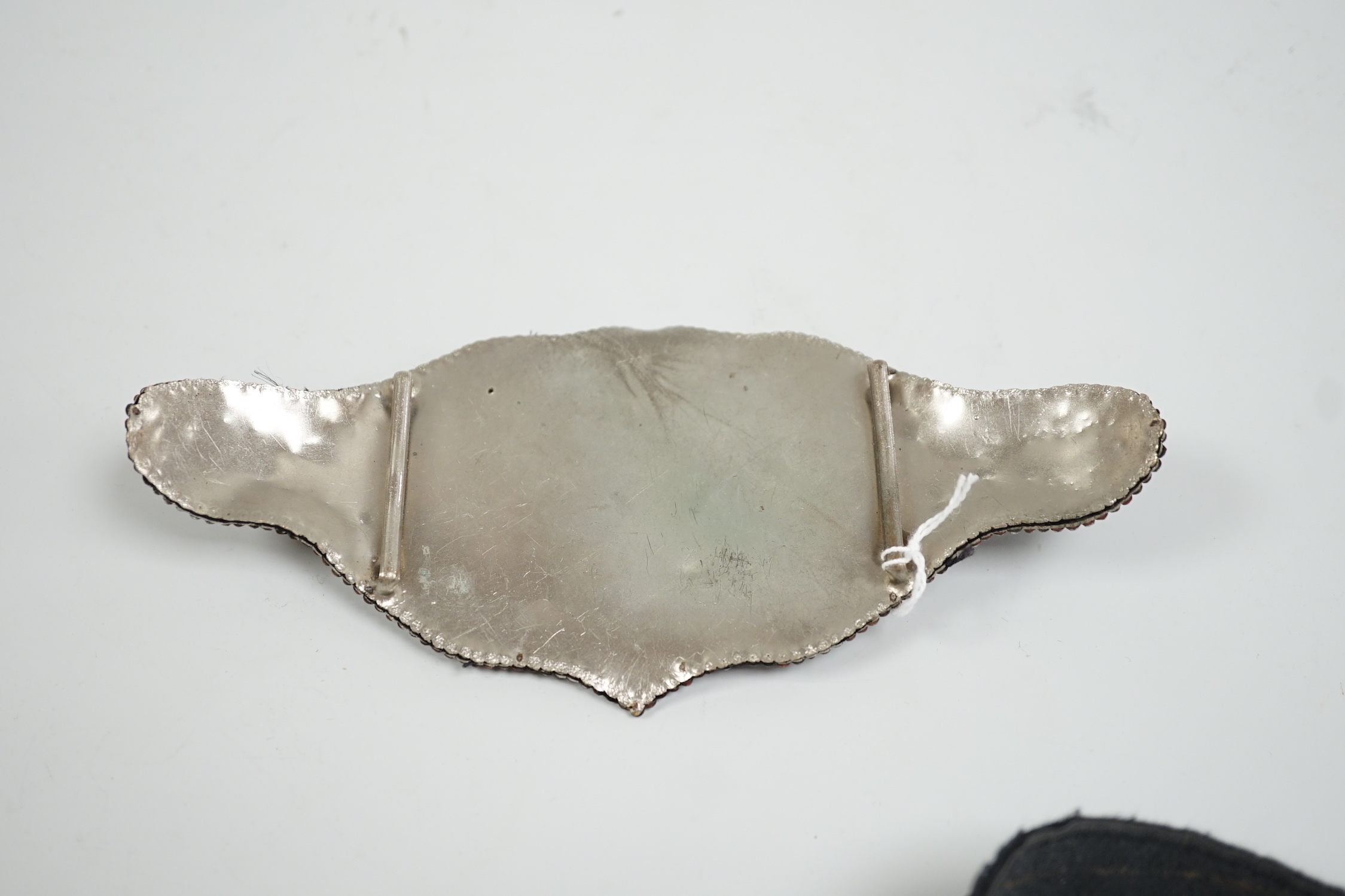 A 19th century cut steel lady’s belt buckle, 19cm wide